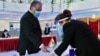 TAJIKISTAN -- Tajik President Emomali Rakhmon receives his ballot at a polling station during presidential election in Dushanbe, October 11, 2020