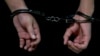 A person in handcuffs at Moscow's Basmanny District Court